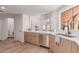 Kitchen features stainless steel appliances, white countertops, and wood-look flooring at 6439 E Redmont Dr, Mesa, AZ 85215