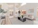 Bright living room with soaring ceilings, fireplace, and stylish furnishings at 6439 E Redmont Dr, Mesa, AZ 85215