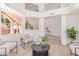 Bright living room showcases a high ceiling and view to a stairway at 6439 E Redmont Dr, Mesa, AZ 85215