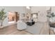 Spacious living room with high ceilings, modern furniture, and sliding door access to patio at 6439 E Redmont Dr, Mesa, AZ 85215