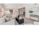 Open concept living room flows into the kitchen, perfect for entertaining at 6439 E Redmont Dr, Mesa, AZ 85215