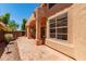 The covered patio features red clay tiles and provides backyard access through sliding glass doors at 6439 E Redmont Dr, Mesa, AZ 85215