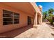 The covered patio features red clay tiles and provides backyard access through sliding glass doors at 6439 E Redmont Dr, Mesa, AZ 85215