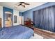 Primary bedroom featuring a wood-framed bed and views to ensuite bath and walk-in closet at 776 W Carob Way, Chandler, AZ 85248