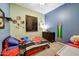 bedroom with colorful walls, cartoon character decor, and a ceiling fan at 776 W Carob Way, Chandler, AZ 85248