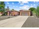 Charming single-story home with a spacious driveway and desert landscaping at 776 W Carob Way, Chandler, AZ 85248