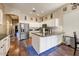 Spacious kitchen with an island, stainless steel appliances, and hardwood floors at 776 W Carob Way, Chandler, AZ 85248