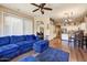 Open concept living room with wood floors, comfortable sofa, and easy access to the kitchen at 776 W Carob Way, Chandler, AZ 85248