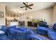 Open concept living room featuring wood floors, comfortable seating, and views to the kitchen at 776 W Carob Way, Chandler, AZ 85248