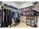 Spacious walk-in closet featuring ample hanging storage space and shelving at 776 W Carob Way, Chandler, AZ 85248