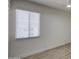 Bright bedroom features a window, ceiling fan, light-colored floors, and neutral walls at 7920 E Camelback Rd # 609, Scottsdale, AZ 85251