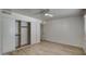 Spacious bedroom with light-colored floors, neutral walls, a ceiling fan, and a closet with sliding doors at 7920 E Camelback Rd # 609, Scottsdale, AZ 85251