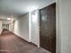 Long hallway with carpet and unit #609 at the end at 7920 E Camelback Rd # 609, Scottsdale, AZ 85251