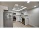 Modern kitchen with white cabinets, quartz countertops, stainless steel appliances, and ample natural light at 7920 E Camelback Rd # 609, Scottsdale, AZ 85251