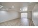 Large living room with a ceiling fan, light-colored floors, neutral walls and lots of natural light at 7920 E Camelback Rd # 609, Scottsdale, AZ 85251