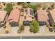 Neighborhood aerial view of a two-story home featuring solar panels and a well-maintained yard at 8259 W Carol Ave, Peoria, AZ 85345