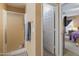 Bathroom featuring a glass shower and views into the bedroom at 8259 W Carol Ave, Peoria, AZ 85345