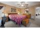 Cozy bedroom featuring a ceiling fan, lamps and wooden furniture at 8259 W Carol Ave, Peoria, AZ 85345
