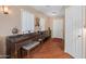 Welcoming foyer featuring a piano, wood floors, and decorative lighting at 8259 W Carol Ave, Peoria, AZ 85345