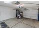Garage featuring concrete floor and many white storage cabinets at 8259 W Carol Ave, Peoria, AZ 85345
