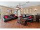 Cozy living room featuring dual couches, a center table, and soft interior lighting at 8259 W Carol Ave, Peoria, AZ 85345