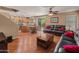 A living room that flows into a casual dining area, with wood floors and abundant light at 8259 W Carol Ave, Peoria, AZ 85345