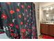 Bathroom with floral shower curtain and vanity with mirror at 8421 E Main St # 116, Mesa, AZ 85207