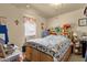 Bright bedroom with a cozy quilt and ample natural light at 8421 E Main St # 116, Mesa, AZ 85207