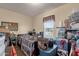 View of a cluttered bedroom with a window and personal items at 8421 E Main St # 116, Mesa, AZ 85207