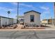Charming manufactured home showcasing a unique landscape design with desert plants and a welcoming, clean exterior at 8421 E Main St # 116, Mesa, AZ 85207