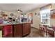 View of the kitchen featuring dark wood cabinets and a breakfast nook at 8421 E Main St # 116, Mesa, AZ 85207