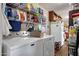 Laundry area with washer, dryer, and shelving for ample storage at 8421 E Main St # 116, Mesa, AZ 85207