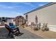 Charming patio area, complete with outdoor furniture, plants and red-roofed shed at 8421 E Main St # 116, Mesa, AZ 85207