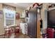 Additional storage area featuring a freezer and storage closet with a window view at 8421 E Main St # 116, Mesa, AZ 85207