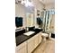 This bathroom has a toilet and single sink with mirror above at 9212 W Salter Dr, Peoria, AZ 85382