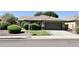Charming single-story home with a tile roof, well-manicured lawn, and a spacious two-car garage at 9212 W Salter Dr, Peoria, AZ 85382
