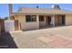 Backyard features a patio and low maintenance desert landscaping at 10326 W Harmont Dr, Peoria, AZ 85345