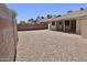 This property features low maintenance desert landscaping at 10326 W Harmont Dr, Peoria, AZ 85345