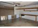 Spacious garage features extra storage and work bench at 10326 W Harmont Dr, Peoria, AZ 85345
