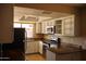 Well-lit kitchen featuring stainless steel appliances, white cabinetry, and light countertops at 10326 W Harmont Dr, Peoria, AZ 85345
