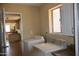 Convenient laundry room with washer, dryer, natural light and easy access to kitchen at 10326 W Harmont Dr, Peoria, AZ 85345