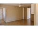 A cozy and neutrally decorated living room with tiled floors and plenty of natural light at 10326 W Harmont Dr, Peoria, AZ 85345