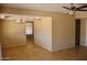 A light-filled living space featuring neutral walls, recessed lighting, and tiled floors at 10326 W Harmont Dr, Peoria, AZ 85345