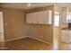 Living room with neutral paint, white cabinetry, and tiled floor; offers plenty of space at 10326 W Harmont Dr, Peoria, AZ 85345