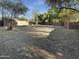 Large, open backyard with mature trees and ample space for outdoor activities and entertainment at 1048 E 6Th Ave, Mesa, AZ 85204