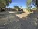 Spacious backyard with a partially shaded area and privacy fencing perfect for recreation or a garden at 1048 E 6Th Ave, Mesa, AZ 85204