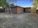 Spacious backyard featuring a gravel ground cover and perimeter fencing at 1048 E 6Th Ave, Mesa, AZ 85204