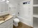 Clean, well-maintained bathroom featuring a shower-tub combo with white tile surround at 1048 E 6Th Ave, Mesa, AZ 85204