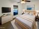 Comfortable bedroom with a queen-sized bed, modern furniture, and ample natural light at 1048 E 6Th Ave, Mesa, AZ 85204