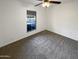 Minimalist bedroom featuring neutral carpeting and ample natural light from the window at 1048 E 6Th Ave, Mesa, AZ 85204